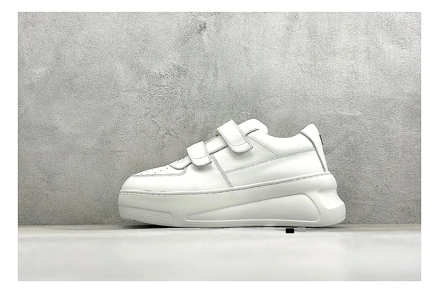 Acne Studios Velcro White Mid-Top spreadsheet record image showing white leather panels, broad hook-and-loop straps, padded mid-top collar, and a clean rubber sole