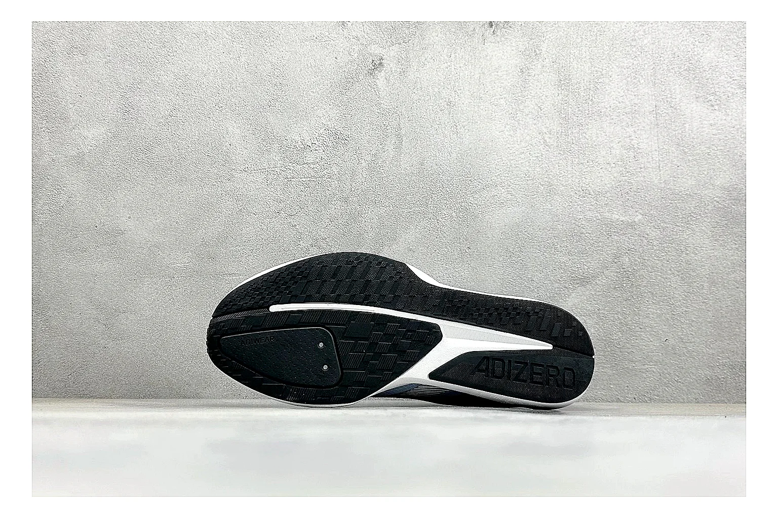 Adidas Adizero Grey Blue spreadsheet record photo showing grey lightweight runner upper, blue Adidas striping, slim racing shape, and low performance sole
