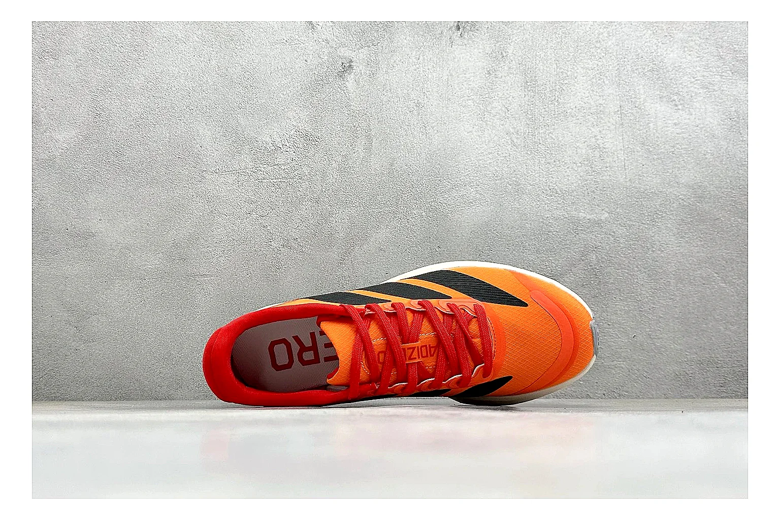 Adidas Adizero Orange Black spreadsheet record photo showing orange runner upper, black three-stripe contrast, lightweight racing shape, and thin performance sole thumbnail 2