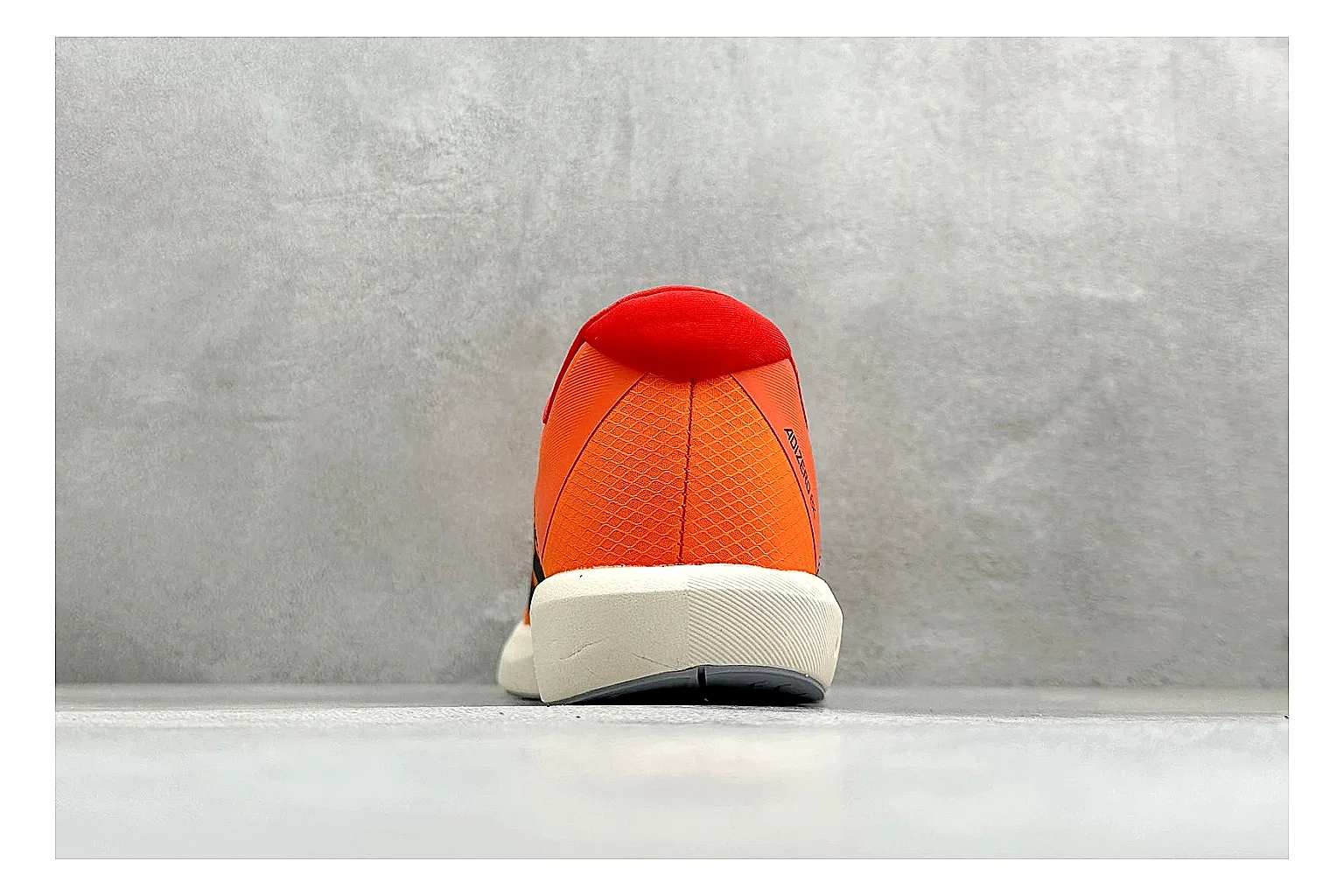 Adidas Adizero Orange Black spreadsheet record photo showing orange runner upper, black three-stripe contrast, lightweight racing shape, and thin performance sole thumbnail 3