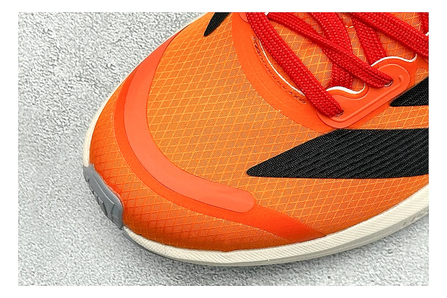Adidas Adizero Orange Black spreadsheet record photo showing orange runner upper, black three-stripe contrast, lightweight racing shape, and thin performance sole thumbnail 5