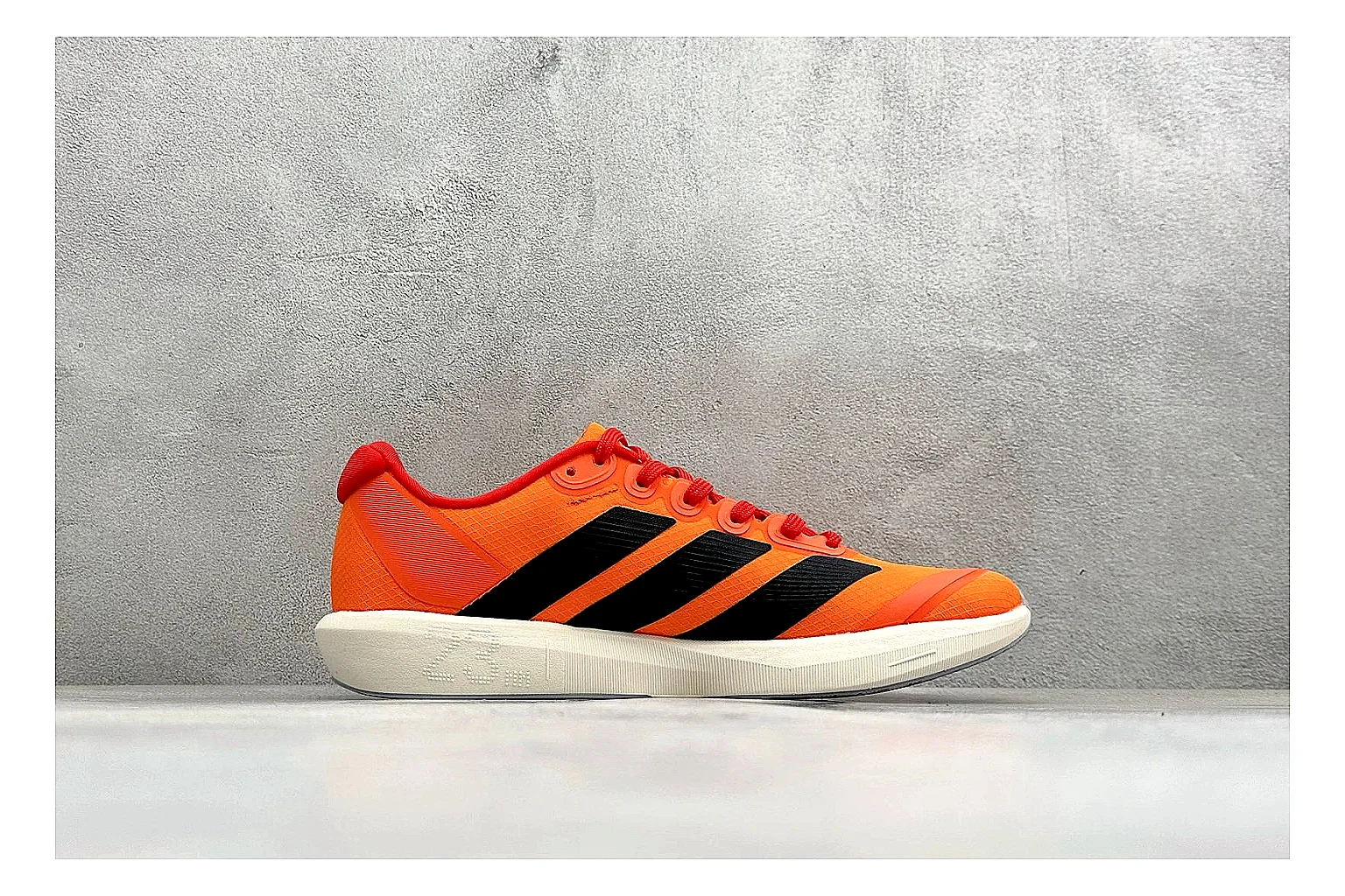 Adidas Adizero Orange Black spreadsheet record photo showing orange runner upper, black three-stripe contrast, lightweight racing shape, and thin performance sole thumbnail 6