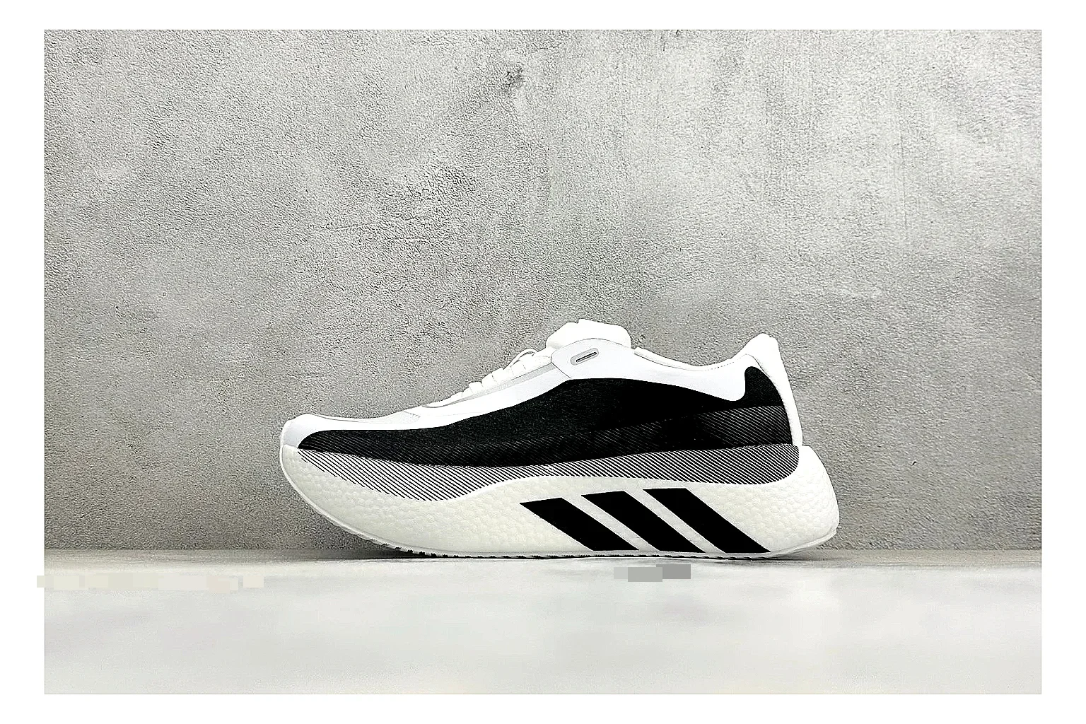 Adidas Hyper Boost White Black spreadsheet record photo showing white knit runner upper, black Adidas striping, sculpted Boost-style sole, and modern low runner profile