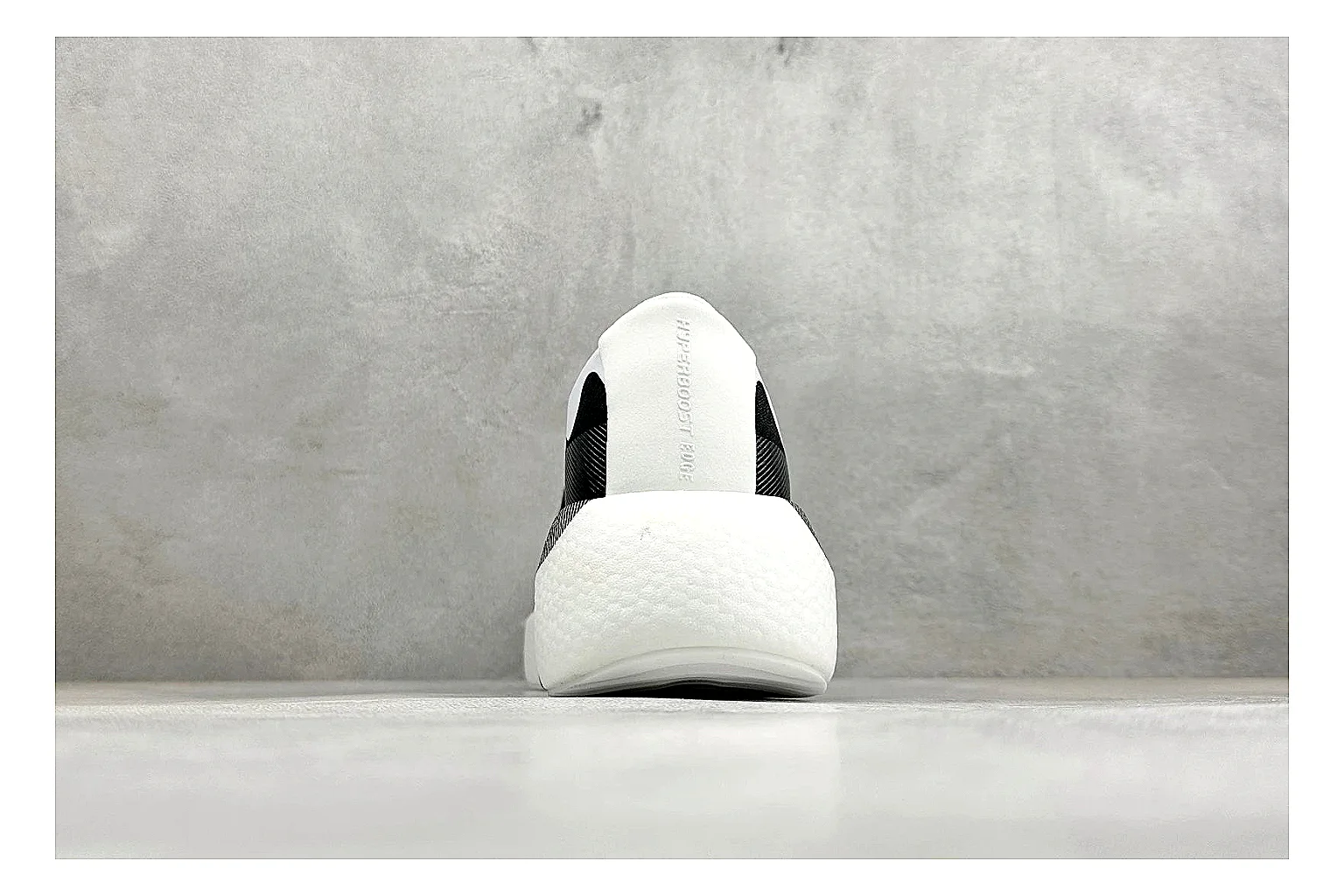 Adidas Hyper Boost White Black spreadsheet record photo showing white knit runner upper, black Adidas striping, sculpted Boost-style sole, and modern low runner profile thumbnail 3