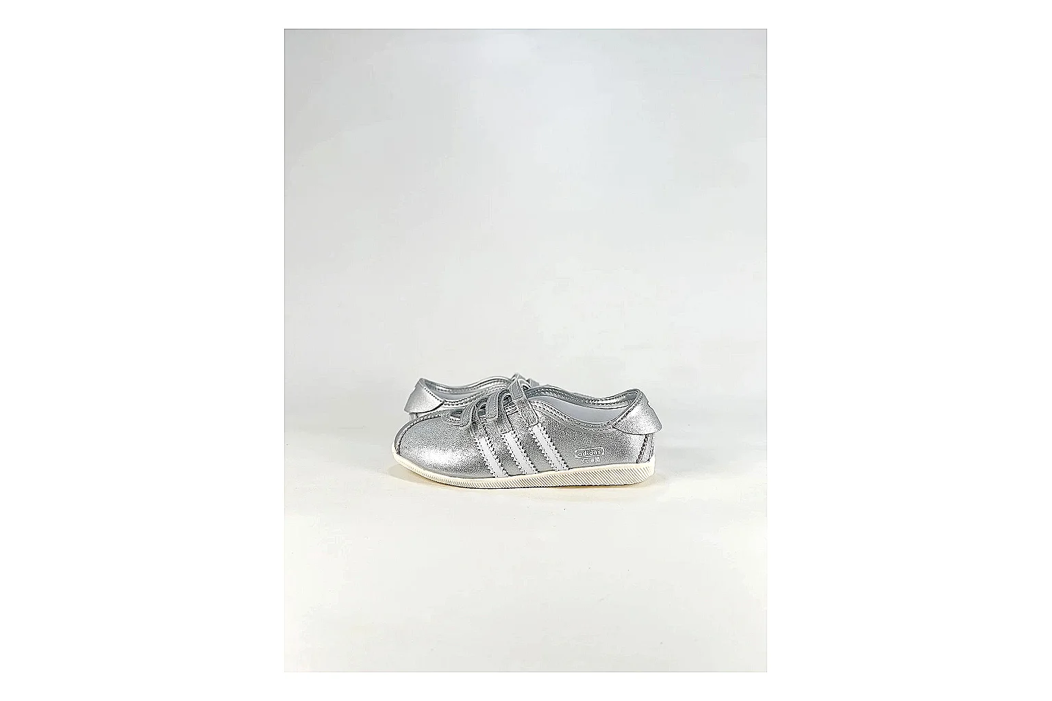 Adidas Originals Anfisa Silver Sneakers spreadsheet record image with silver low-top sneakers with leather texture, side-profile shape, upper panel lines, and outsole detail