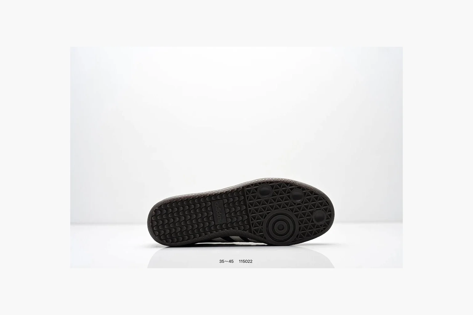 Adidas Samba OG Black White Gold spreadsheet record photo showing black leather-suede low-top upper, white three stripes, gold tongue label, gum sole, and classic Samba side profile