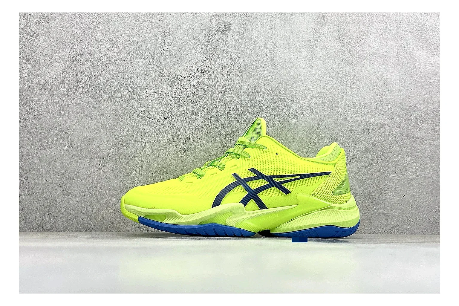 Asics Court FF Volt Blue spreadsheet record photo showing bright volt and blue court upper, supportive sole wall, Asics side lines, and stable tennis profile