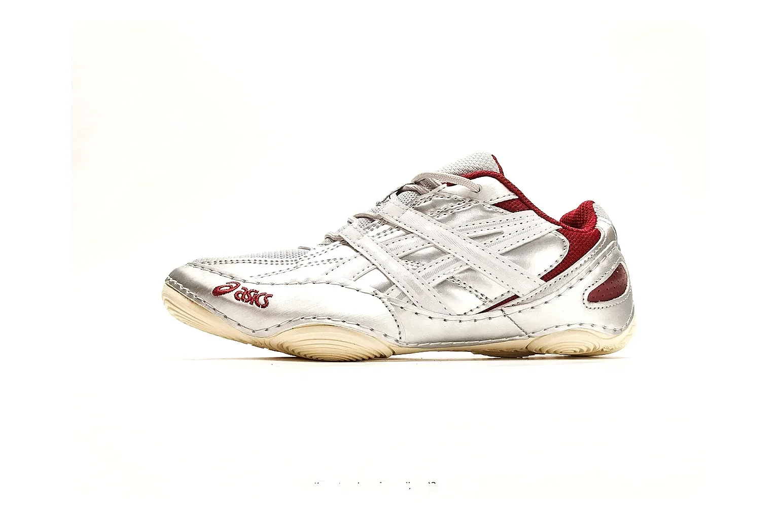 Asics Gel Runner White Red spreadsheet record photo showing white mesh-leather runner upper, red Asics accents, retro gel-runner shape, and cushioned sole