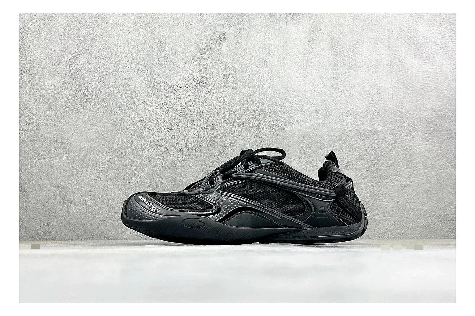 Balenciaga Track Black Low-Top spreadsheet record photo showing black layered technical upper, complex paneling, chunky runner sole, and tactical low-top shape