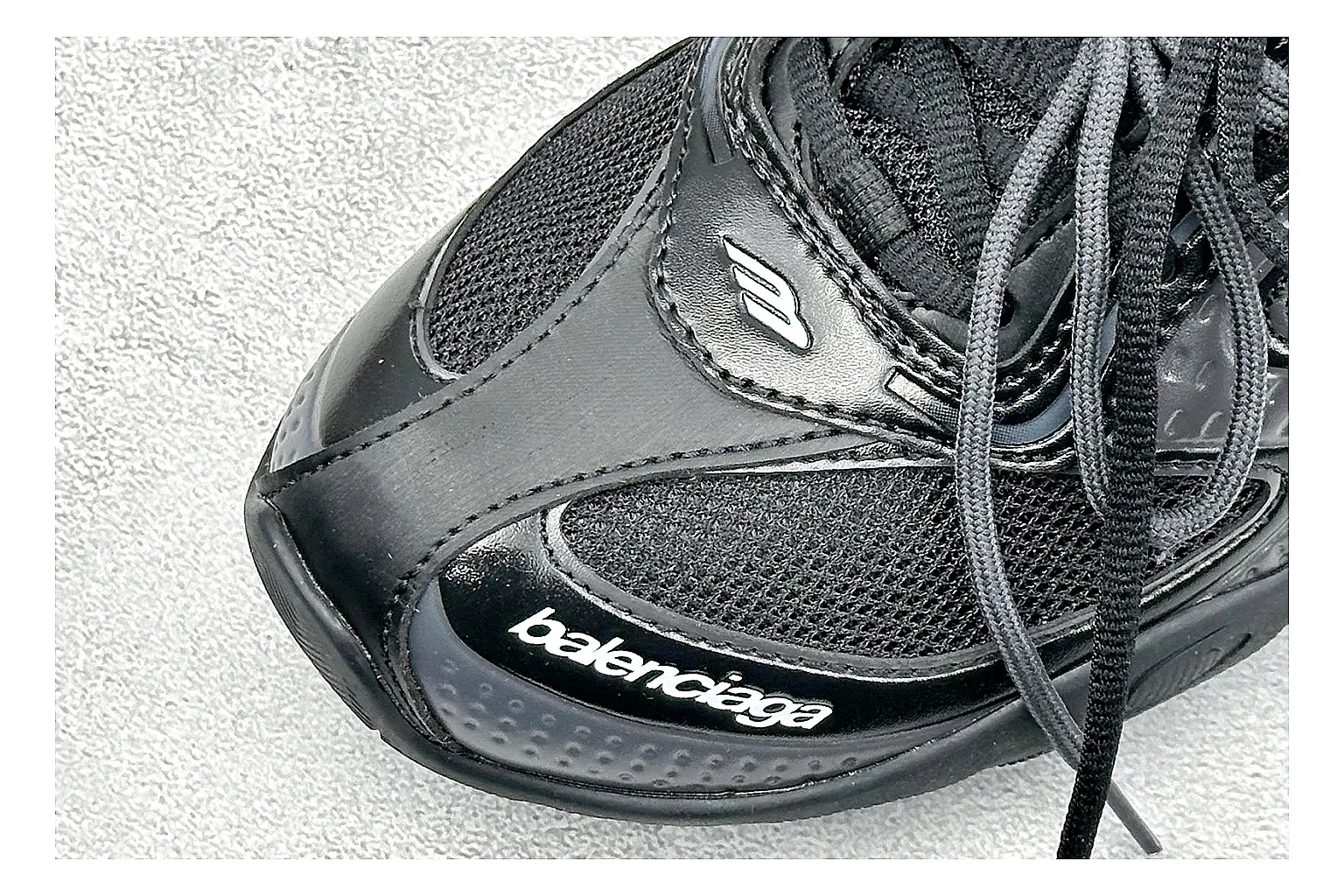 Balenciaga Track Black Low-Top spreadsheet record photo showing black layered technical upper, complex paneling, chunky runner sole, and tactical low-top shape thumbnail 5