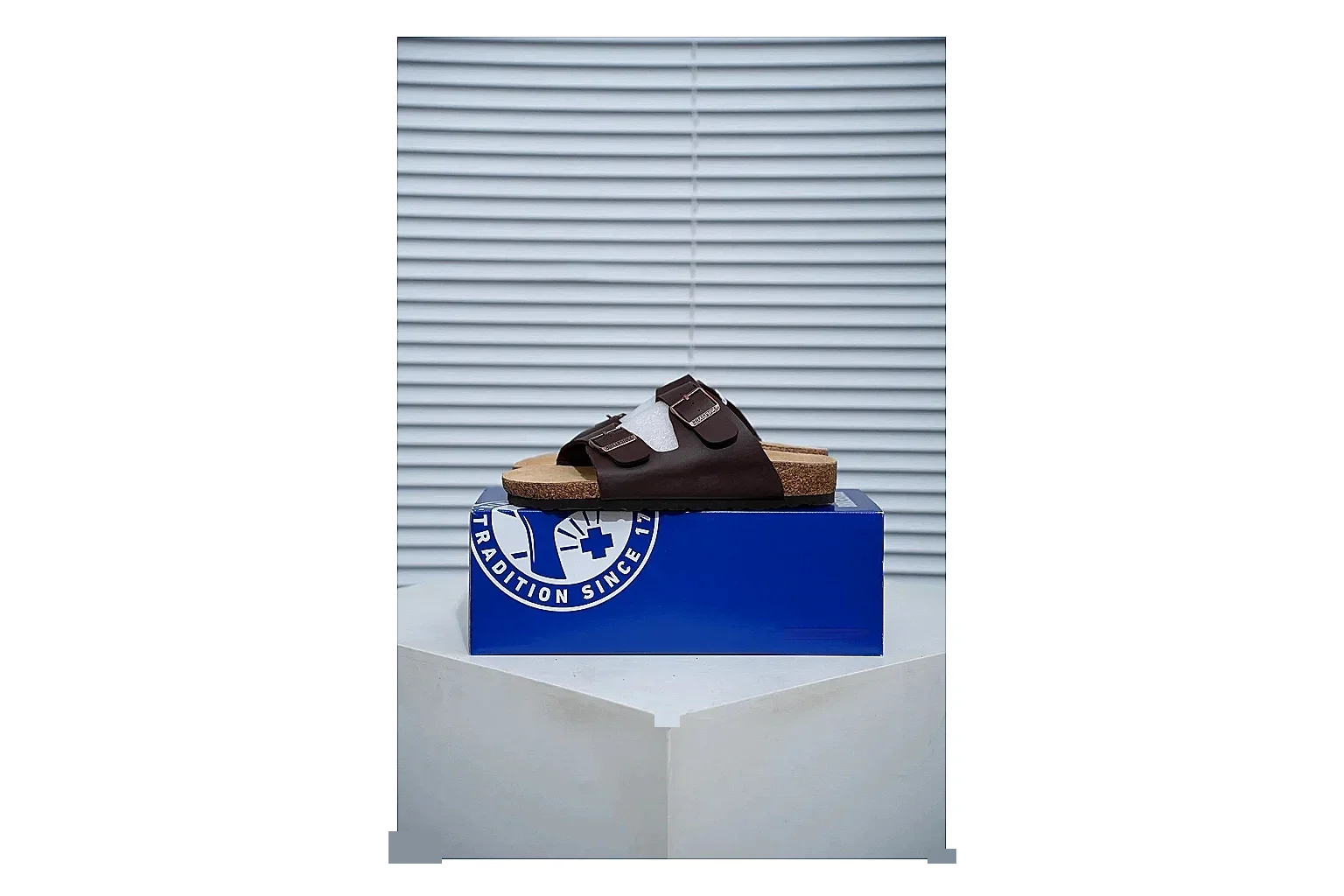 Birkenstock Arizona Mocha Cork Slide Sheetbase record image with adjustable buckles, warm brown upper and contoured footbed for relaxed retro styling
