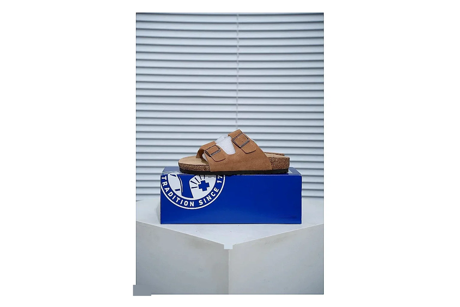Birkenstock Arizona Tan Cork Slide Sheetbase record image with warm brown upper, adjustable buckles and contoured footbed for easy casual outfits