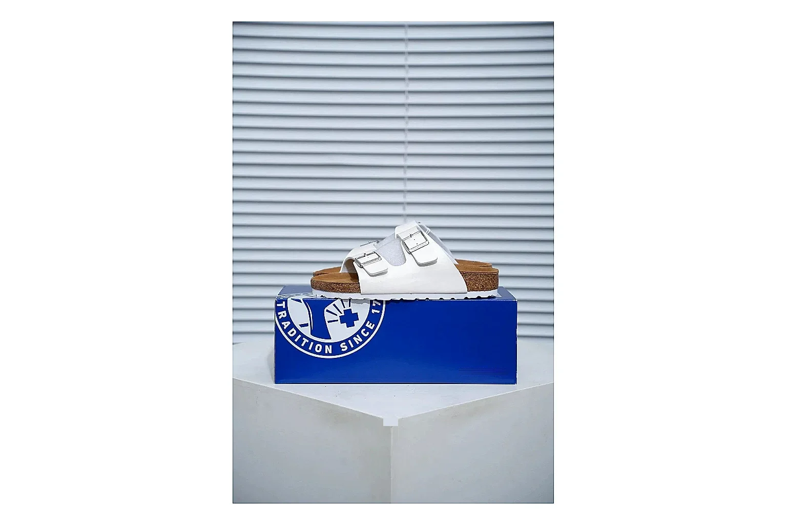 Birkenstock Arizona White Cork Slide Sheetbase record image with adjustable buckles, contoured footbed and black outsole for clean summer casual styling