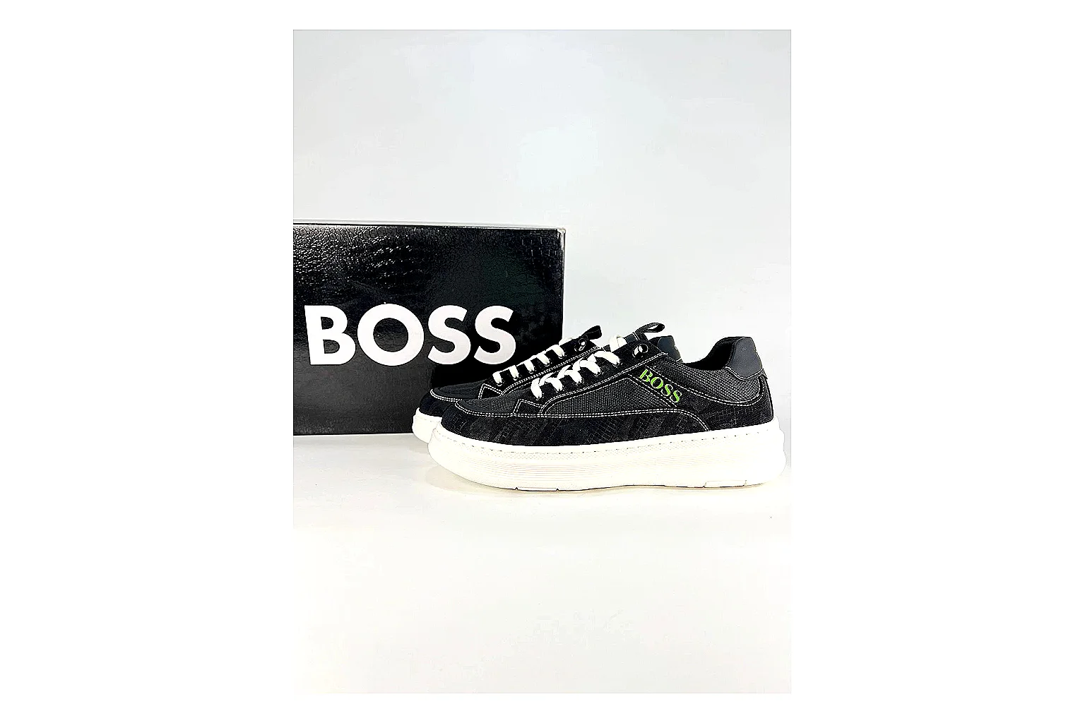 Boss Low Top Black White spreadsheet record photo showing black white leather low-top upper, minimal casual profile, clean panels, and simple rubber sole