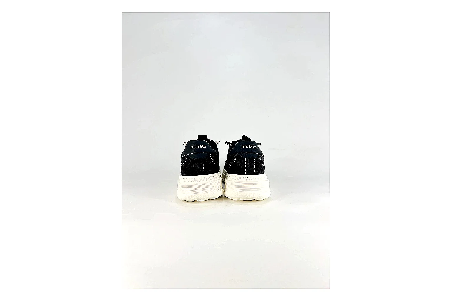 Boss Low Top Black White spreadsheet record photo showing black white leather low-top upper, minimal casual profile, clean panels, and simple rubber sole