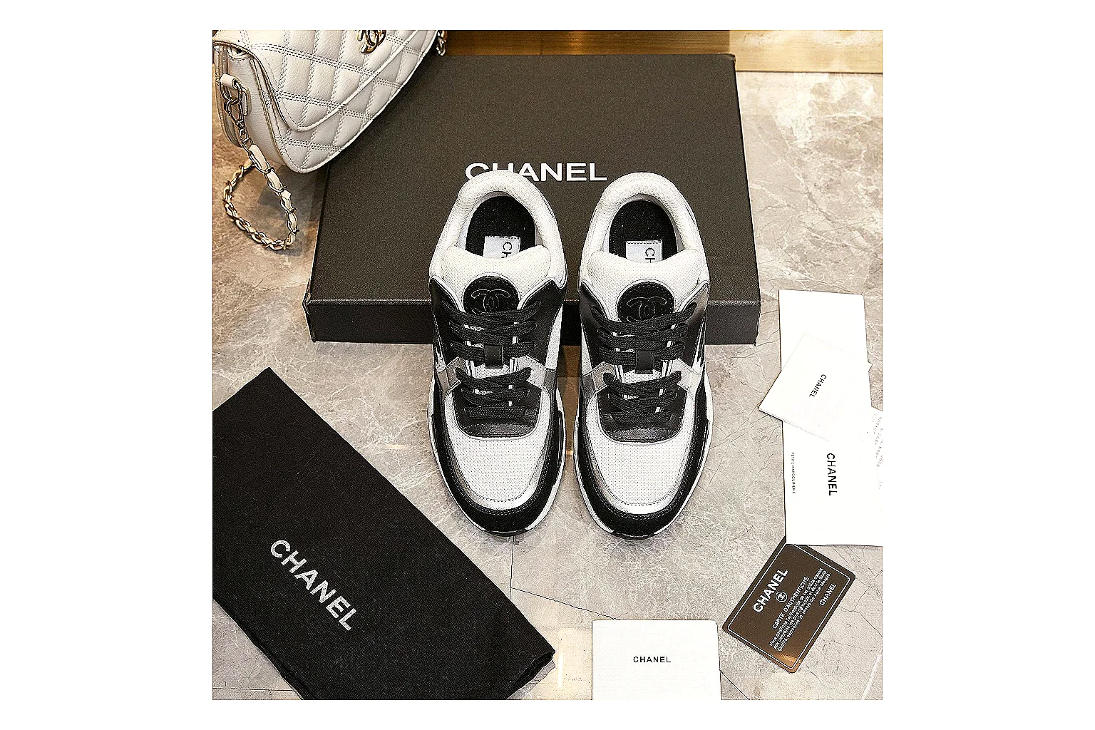 Kako Sheetbase record image for Chanel Black White Runner Sneaker