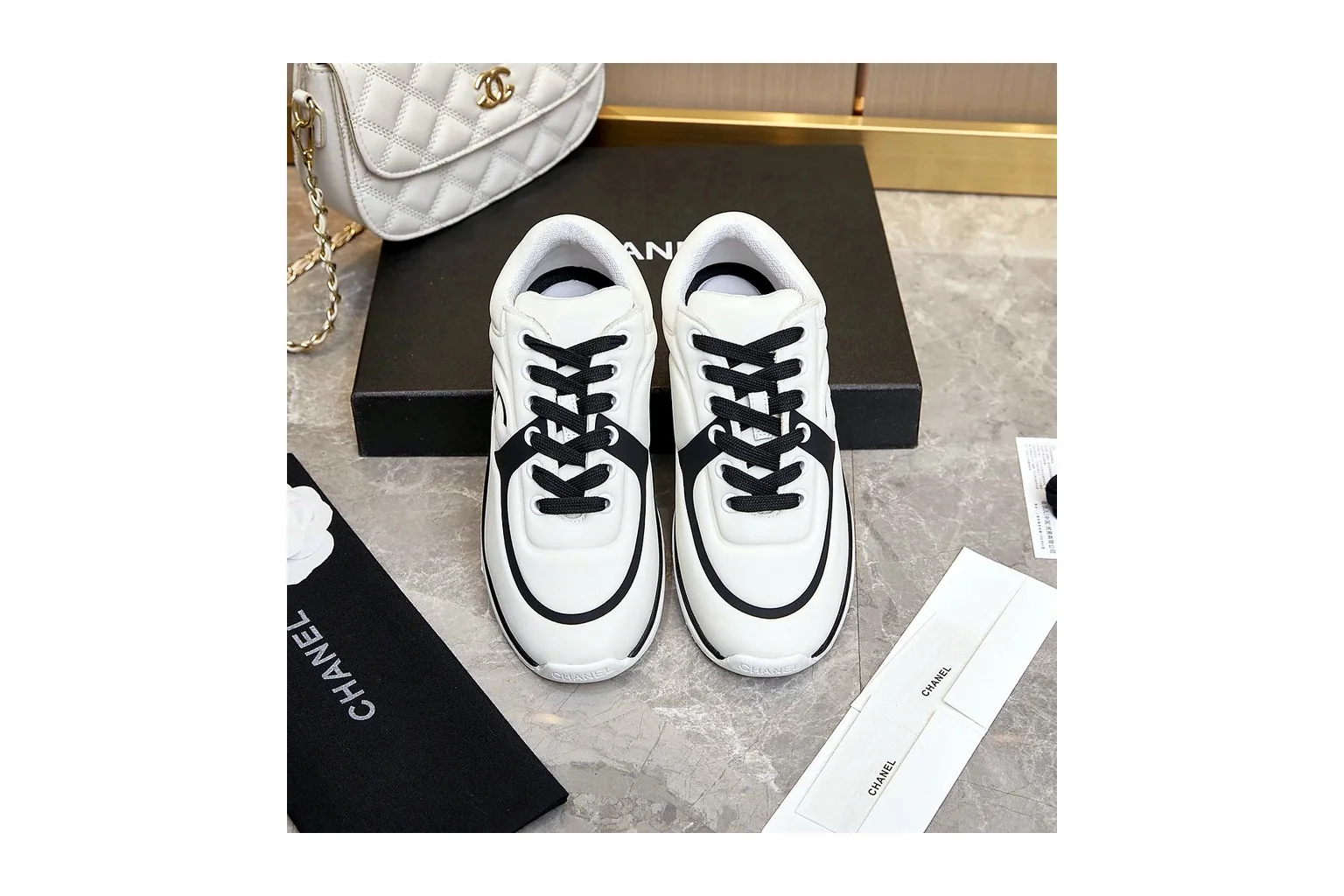 Chanel CC Low Top White Black luxury low top six photo view thumbnail 2