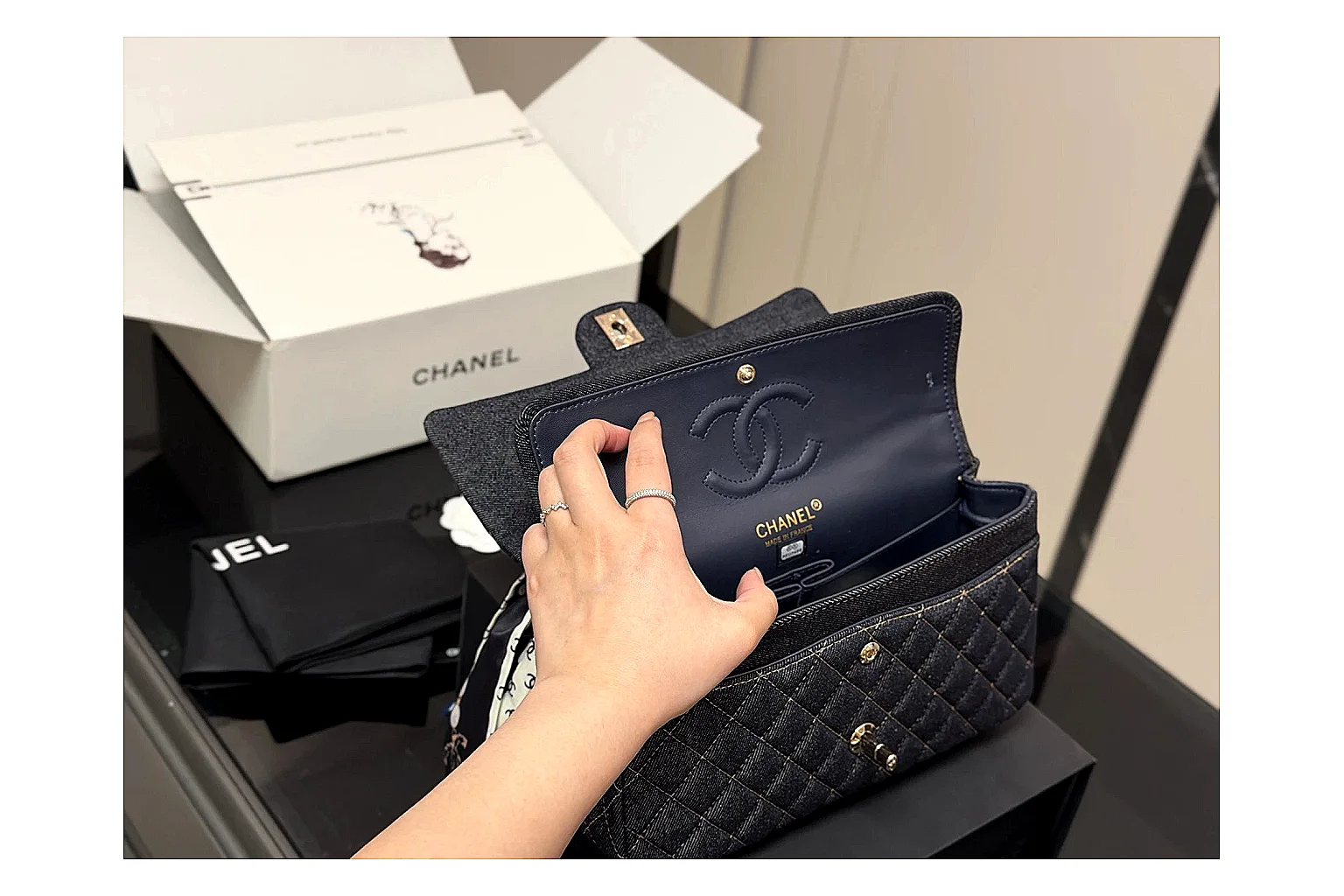 Chanel Quilted Flap Bag Black Navy spreadsheet record photo showing black navy quilted leather body, flap structure, chain strap, and polished luxury hardware
