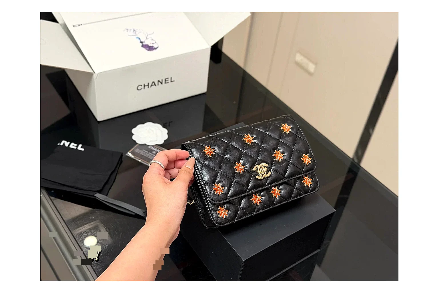 Chanel Quilted Wallet Bag Black Floral spreadsheet record photo showing black quilted wallet-bag body, floral detail, compact flap shape, and polished chain hardware