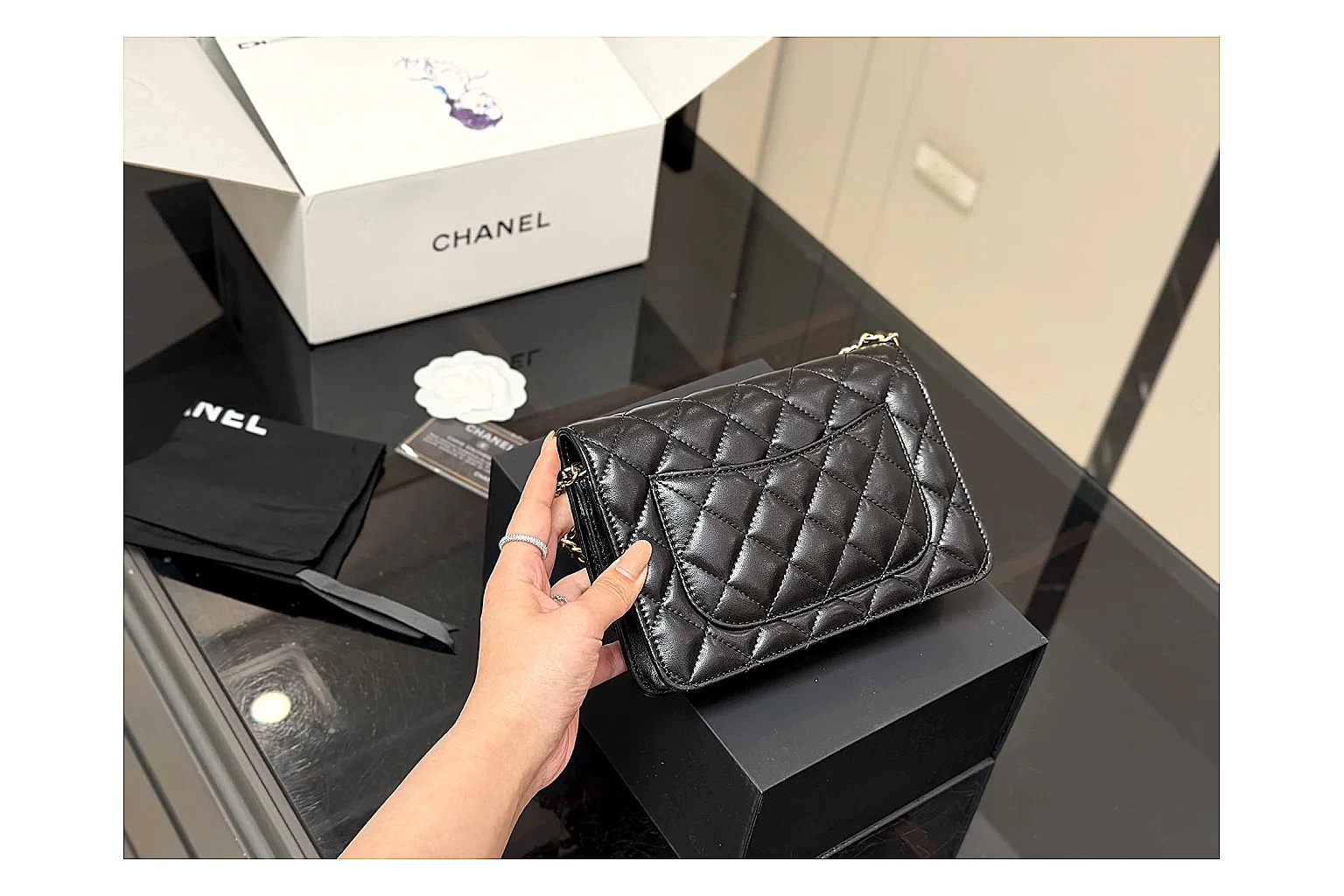 Chanel Quilted Wallet Bag Black Floral spreadsheet record photo showing black quilted wallet-bag body, floral detail, compact flap shape, and polished chain hardware thumbnail 5