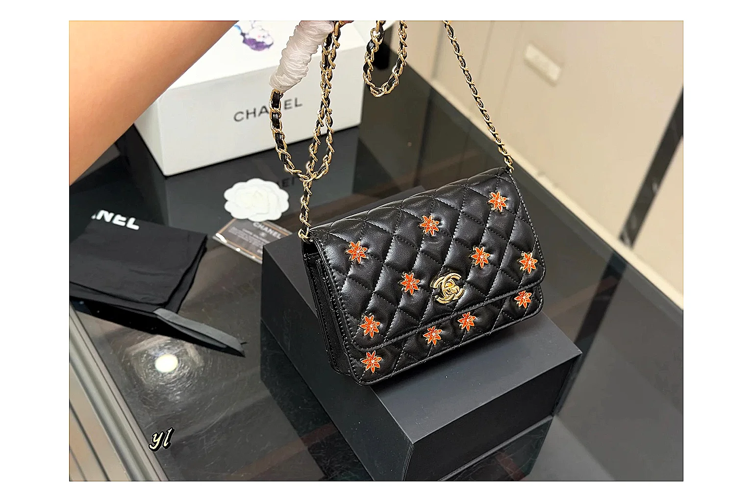 Chanel Quilted Wallet Bag Black Floral spreadsheet record photo showing black quilted wallet-bag body, floral detail, compact flap shape, and polished chain hardware thumbnail 6