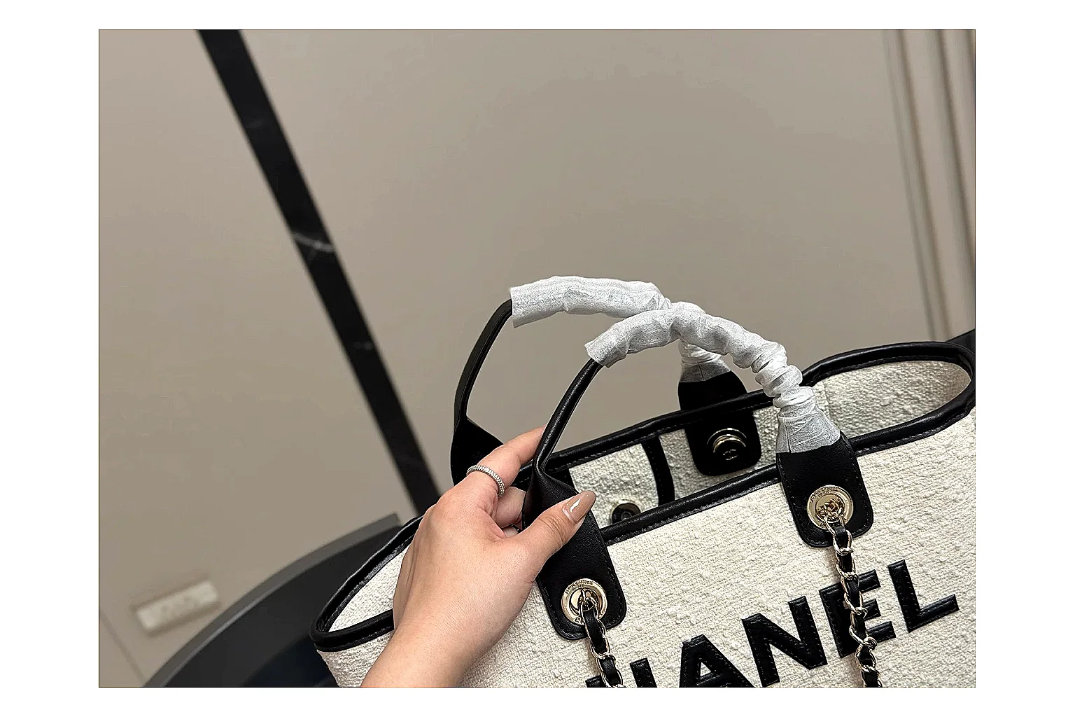 Chanel Tote Bag White Black spreadsheet record photo showing white black canvas-leather tote body, open carry shape, structured handles, and branded luxury-bag details thumbnail 2