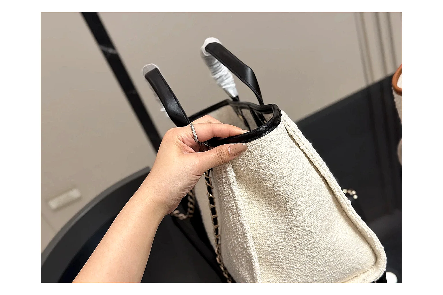 Chanel Tote Bag White Black spreadsheet record photo showing white black canvas-leather tote body, open carry shape, structured handles, and branded luxury-bag details thumbnail 3