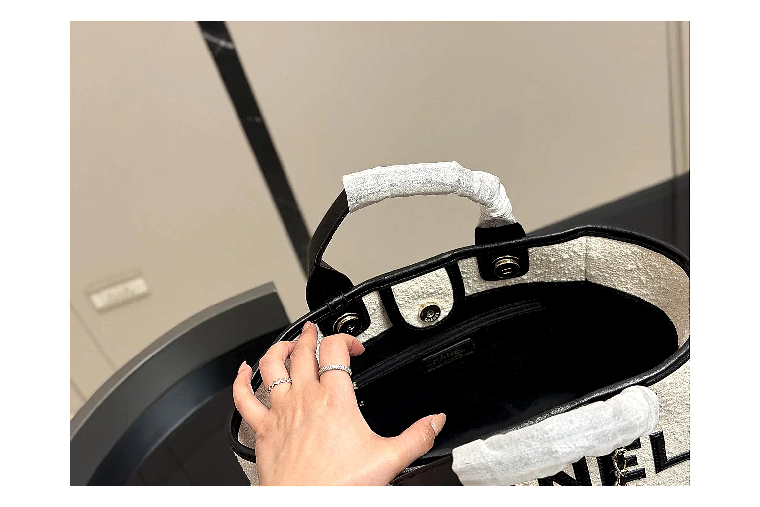 Chanel Tote Bag White Black spreadsheet record photo showing white black canvas-leather tote body, open carry shape, structured handles, and branded luxury-bag details thumbnail 4