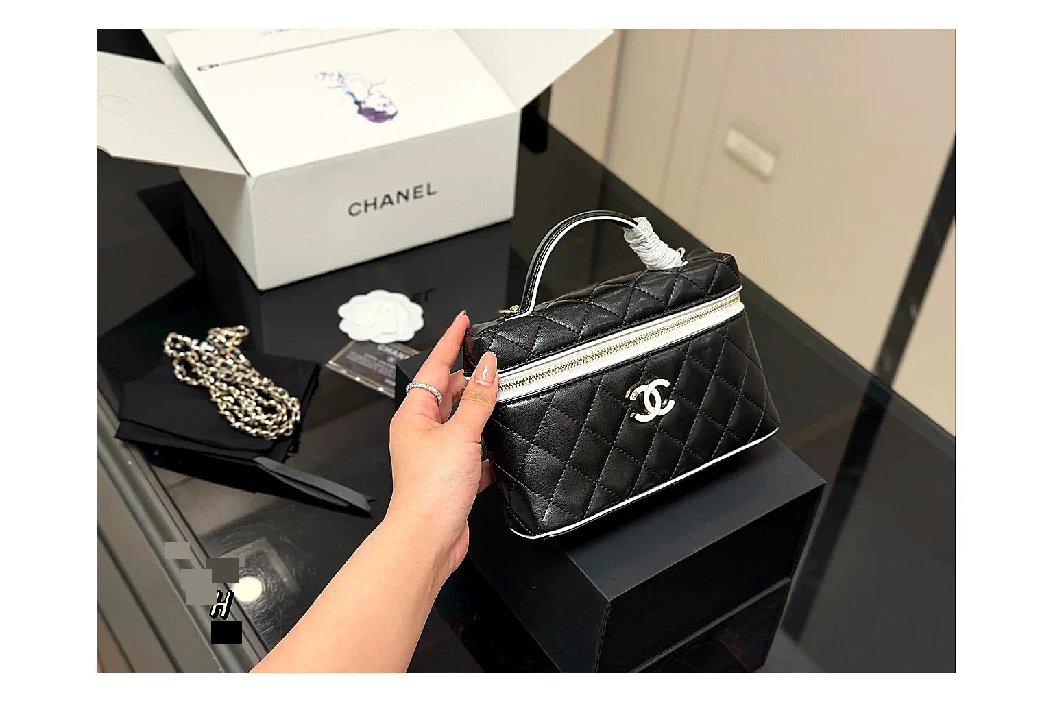 Chanel Wallet On Chain Black spreadsheet record photo showing black quilted leather wallet body, chain strap, flap closure, and compact shoulder-bag profile