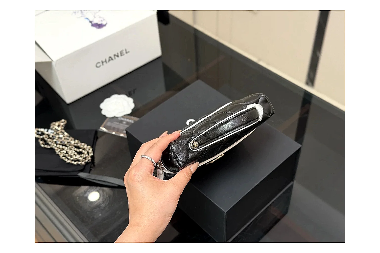 Chanel Wallet On Chain Black spreadsheet record photo showing black quilted leather wallet body, chain strap, flap closure, and compact shoulder-bag profile thumbnail 2