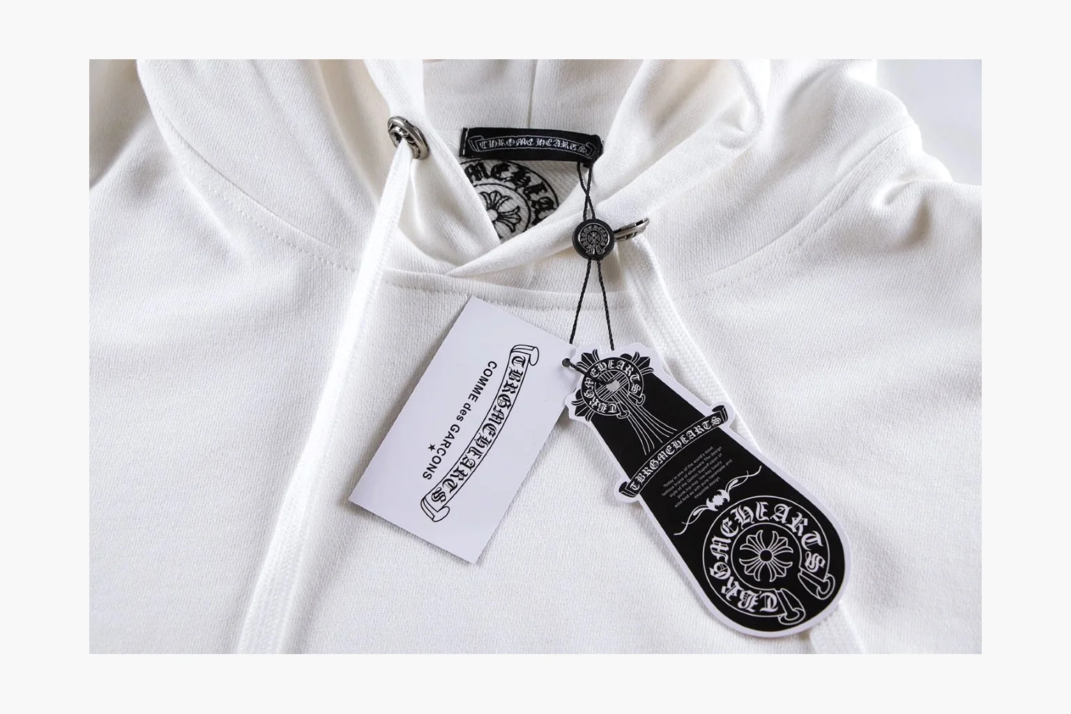 Chrome Hearts White Cross Zip Hoodie spreadsheet record photo showing white cotton fleece zip hoodie, cross back artwork, drawcord hood, sleeve print, front zipper, and ribbed trim thumbnail 2