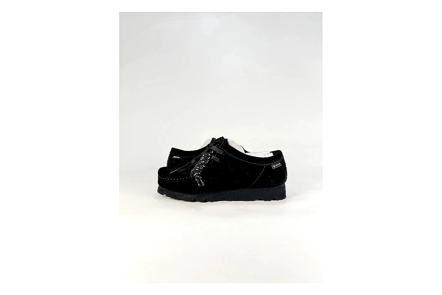 Clarks Wallabee Black Sneakers spreadsheet record image with black suede Wallabee shoes with suede texture, side-profile shape, upper panel lines, and outsole detail
