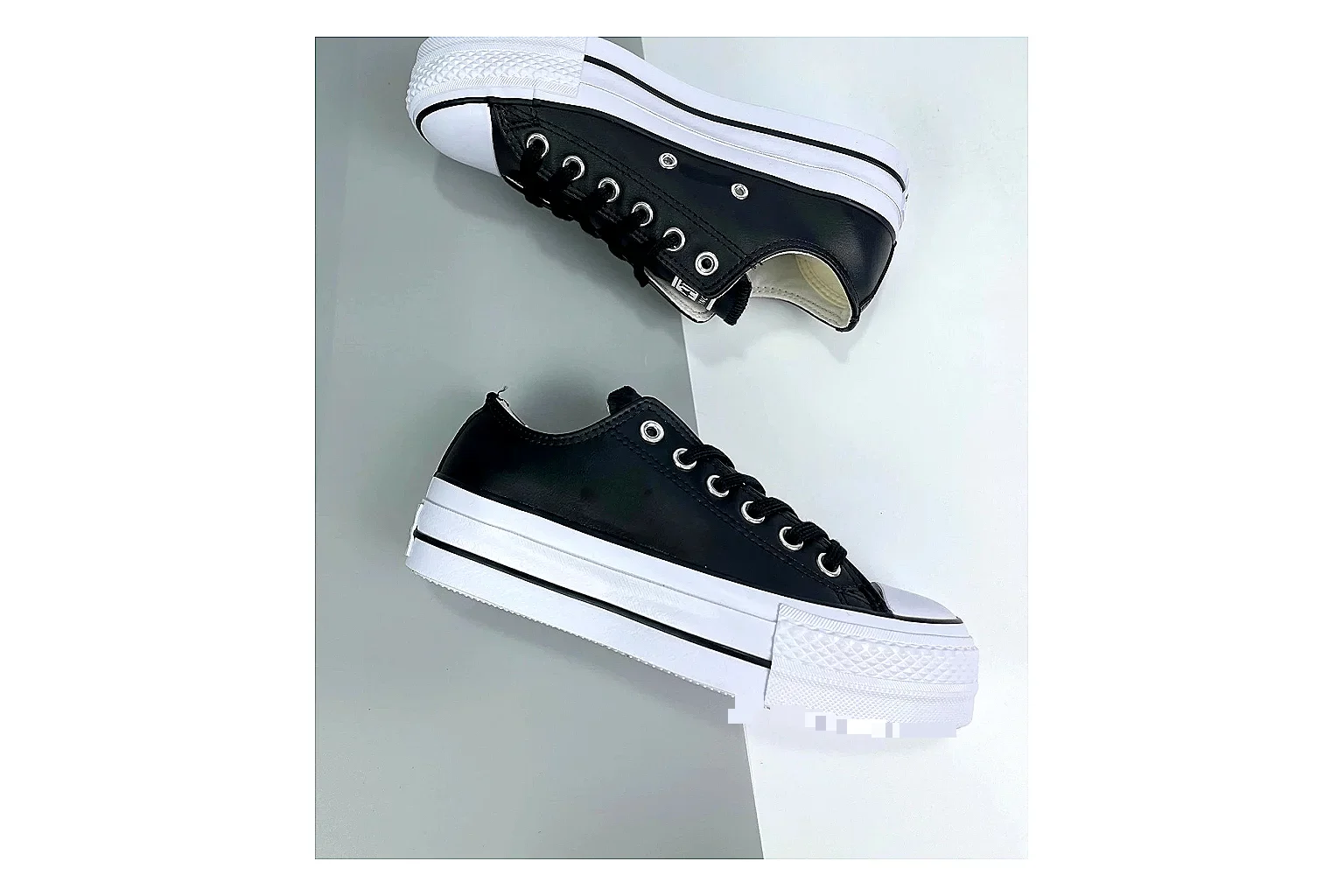 Converse All Star Lift Black Platform Low Top spreadsheet record photo showing black leather low-top upper, silver eyelets, white rubber toe cap, and elevated striped platform sole