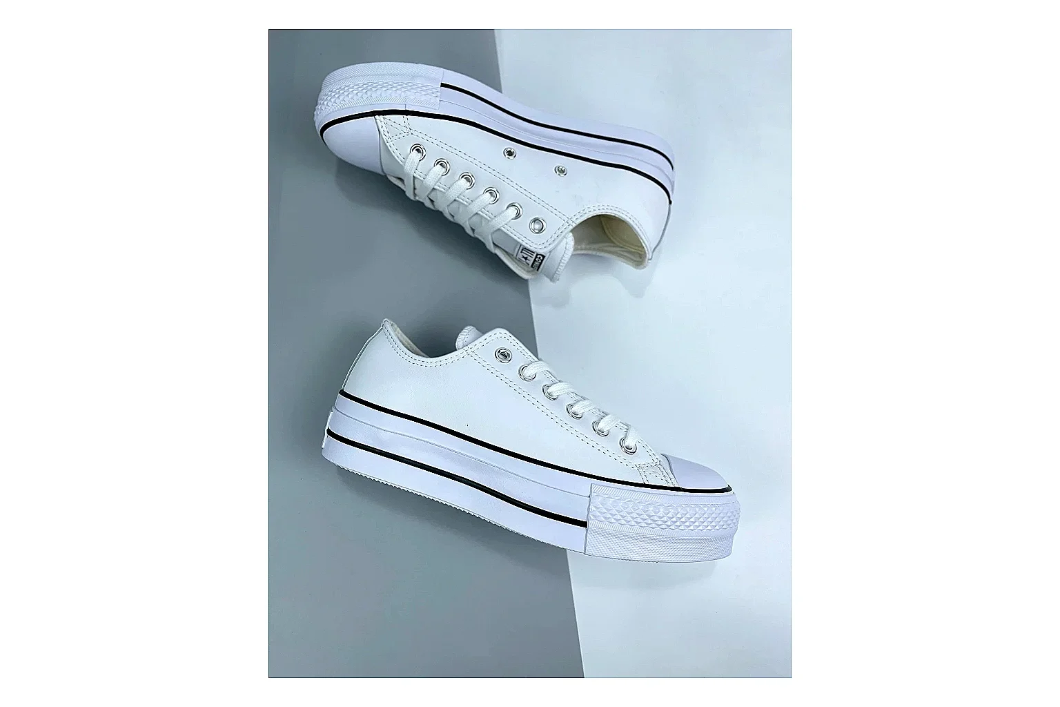 Converse All Star Lift White Platform Low Top spreadsheet record photo showing white smooth low-top upper, silver eyelets, black foxing stripes, and elevated platform rubber sole