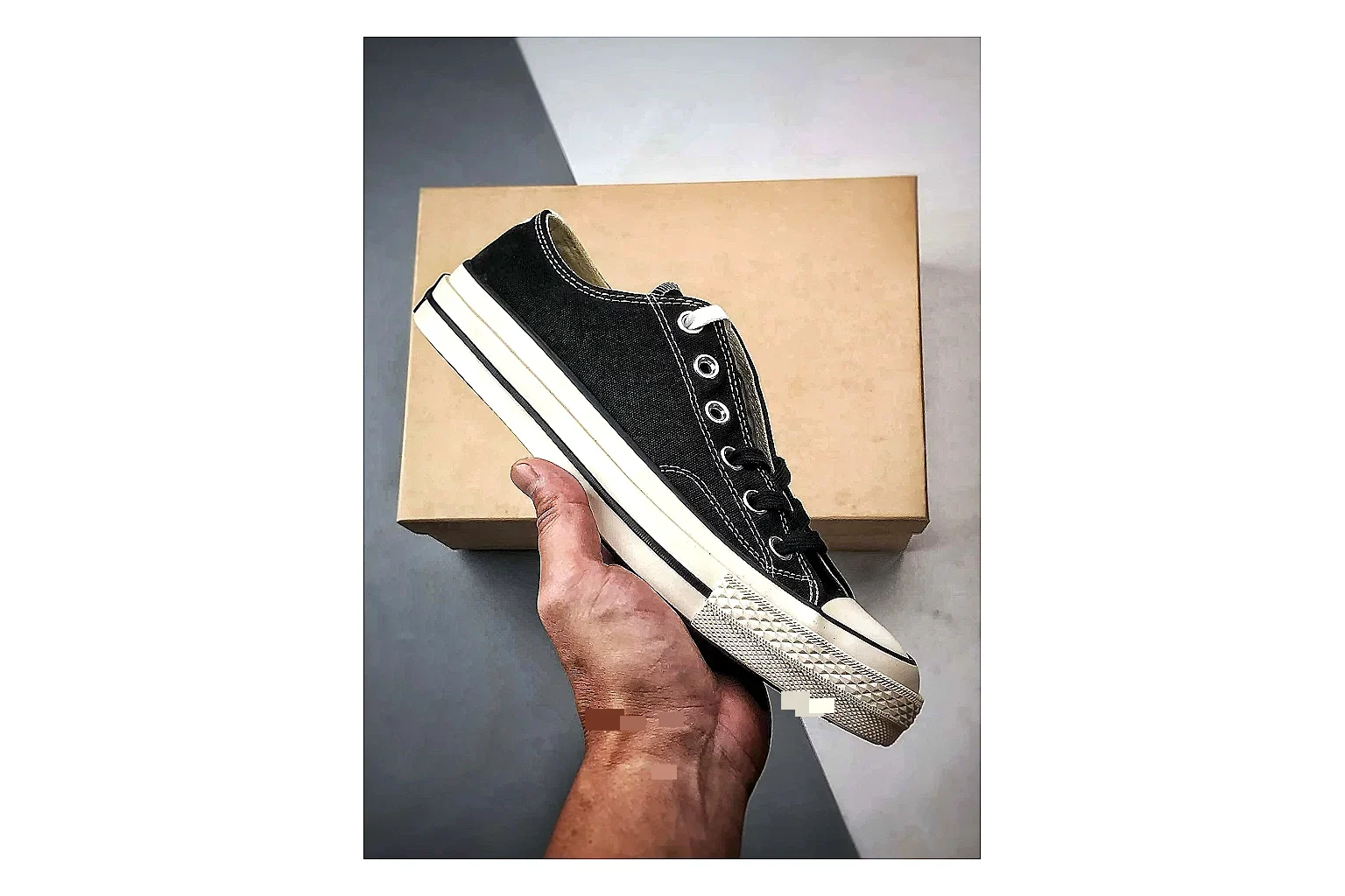 Converse Chuck Low Black White spreadsheet record photo showing black canvas low-top upper, white rubber toe cap, metal eyelets, and classic Converse sole