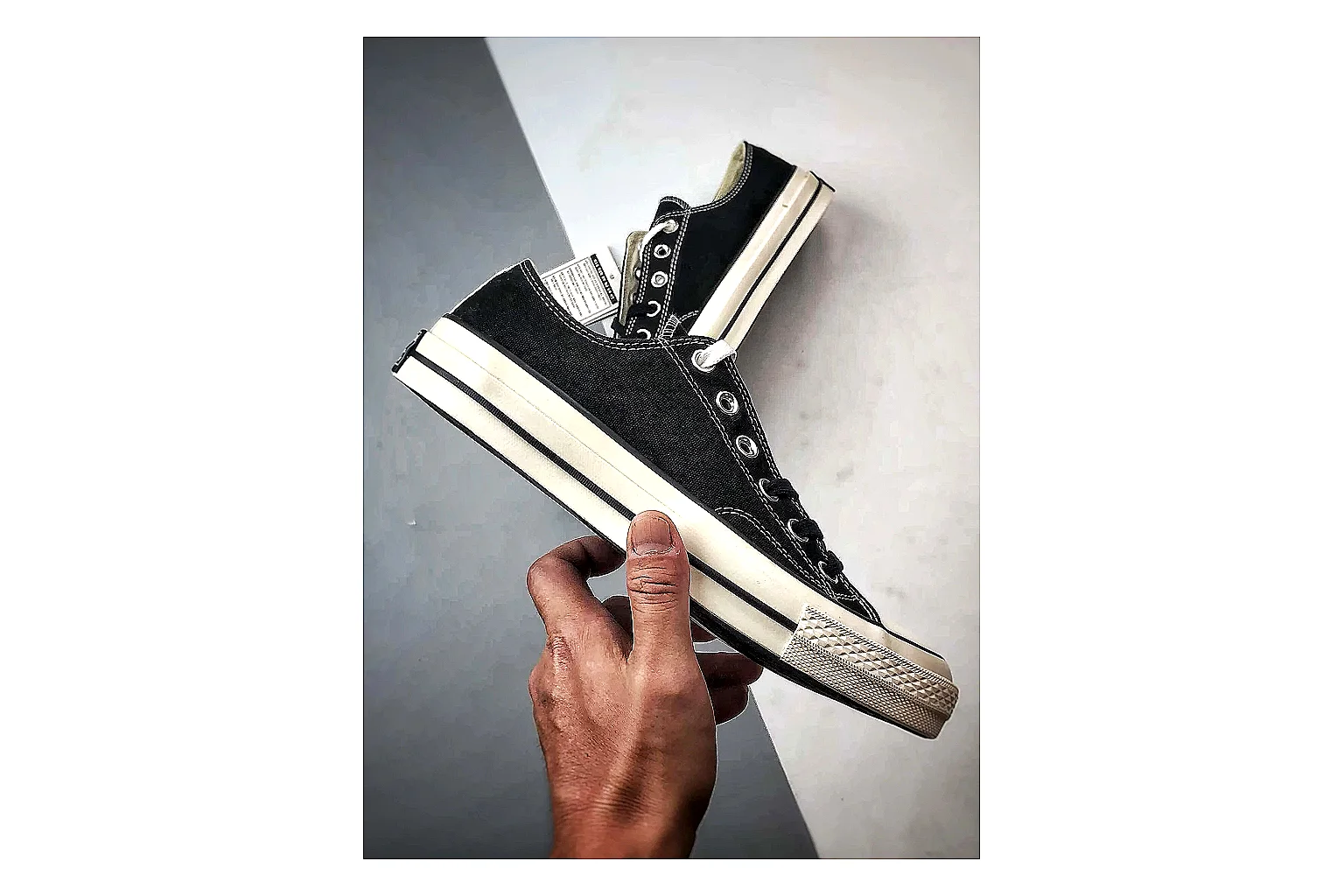 Converse Chuck Low Black White spreadsheet record photo showing black canvas low-top upper, white rubber toe cap, metal eyelets, and classic Converse sole