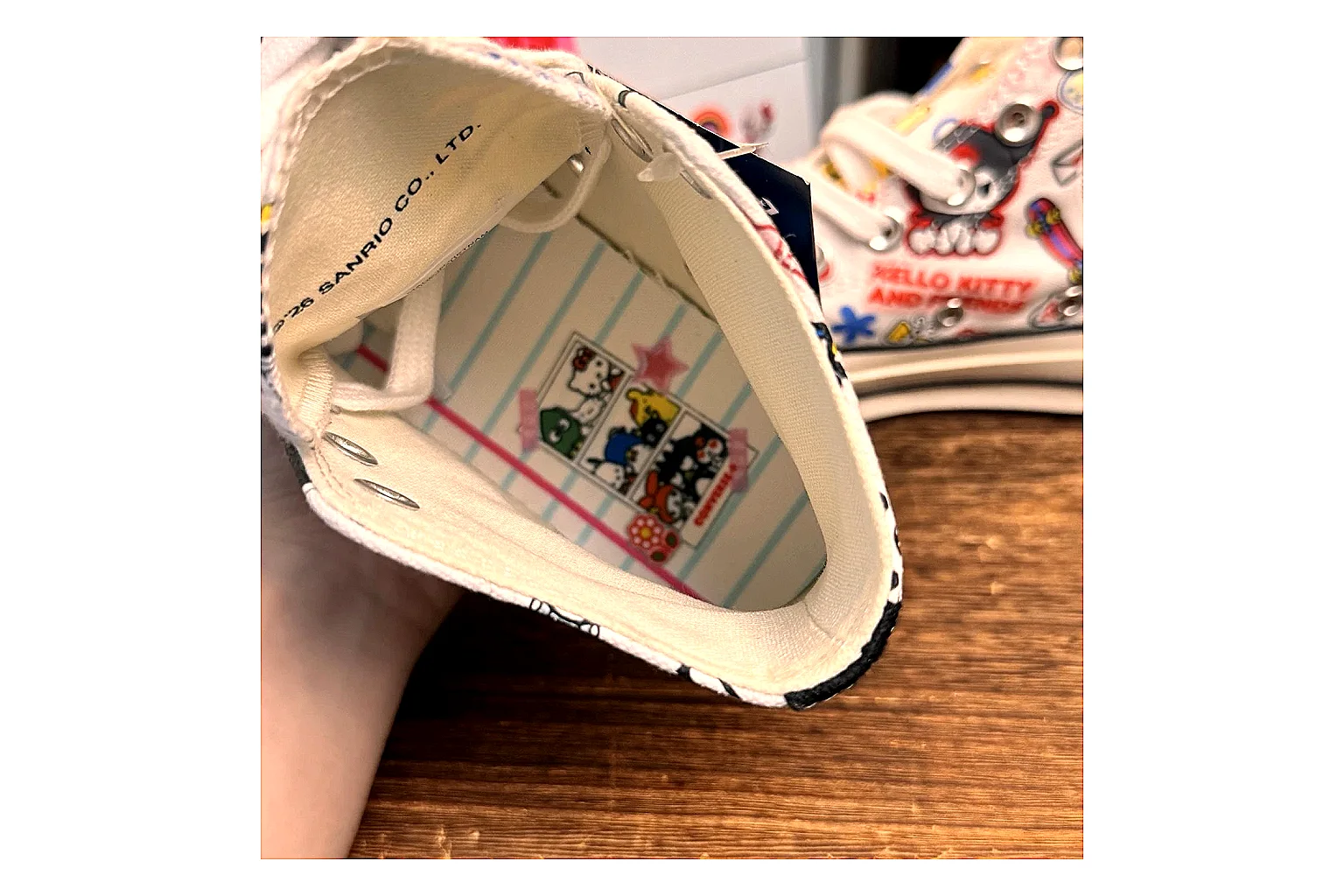 Converse Hello Kitty Chuck 70 High Top spreadsheet record photo showing white canvas high-top upper, colorful character graphics, metal eyelets, rubber toe cap, and elevated vintage sole thumbnail 3