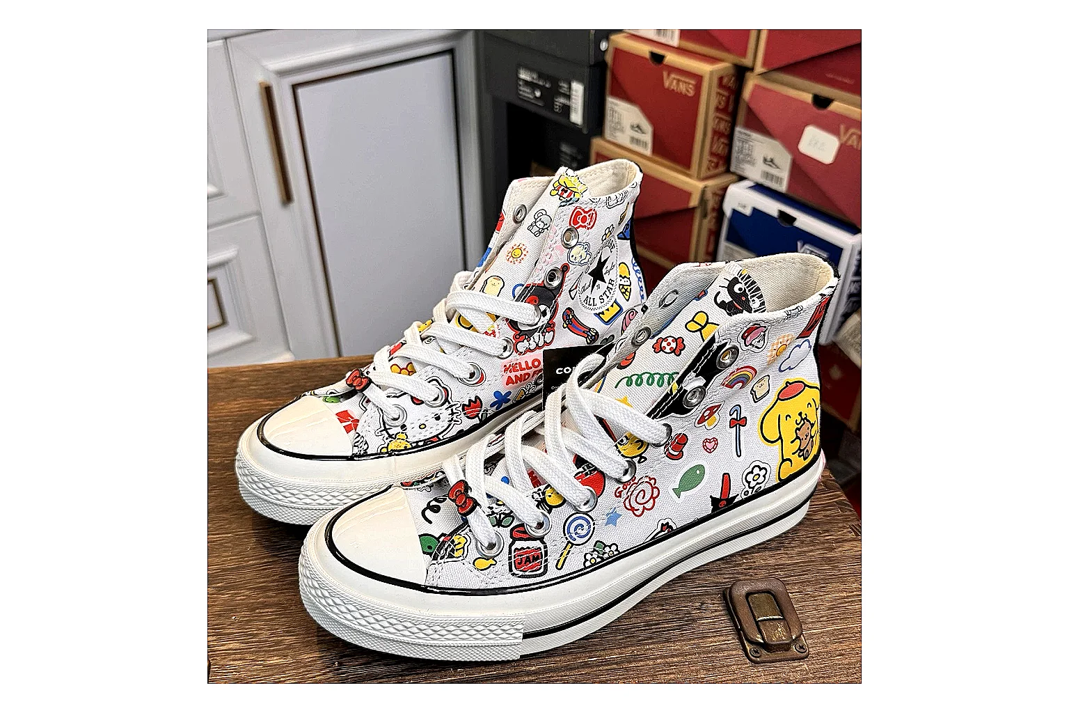 Converse Hello Kitty Chuck 70 High Top spreadsheet record photo showing white canvas high-top upper, colorful character graphics, metal eyelets, rubber toe cap, and elevated vintage sole thumbnail 6