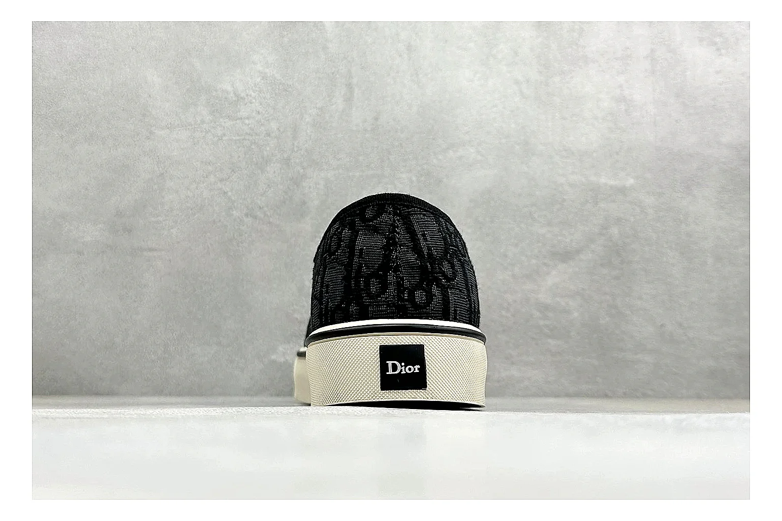 Dior Act Slide Black Low-Top spreadsheet record photo showing black monogram-style upper, low slip-on shape, chunky dark sole, and luxury casual profile thumbnail 3