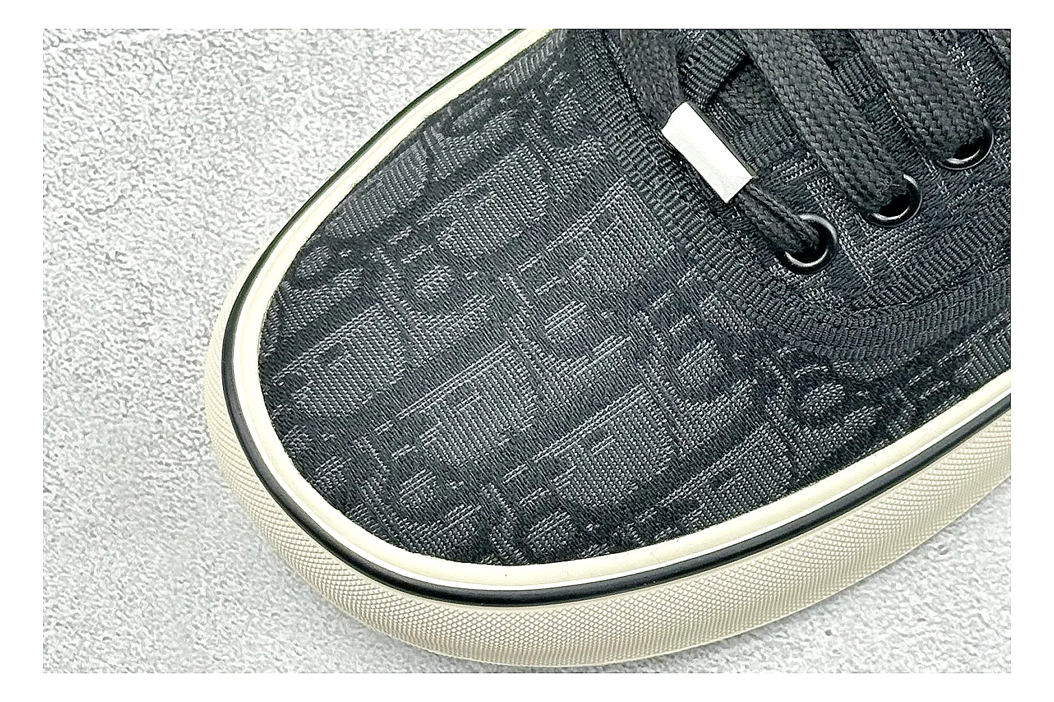 Dior Act Slide Black Low-Top spreadsheet record photo showing black monogram-style upper, low slip-on shape, chunky dark sole, and luxury casual profile thumbnail 5