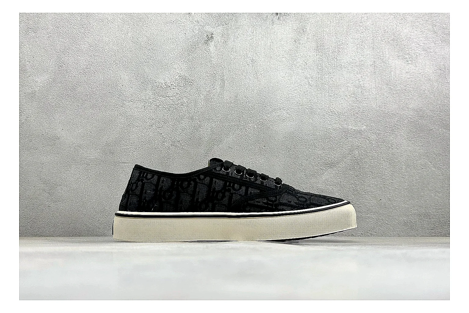 Dior Act Slide Black Low-Top spreadsheet record photo showing black monogram-style upper, low slip-on shape, chunky dark sole, and luxury casual profile thumbnail 6