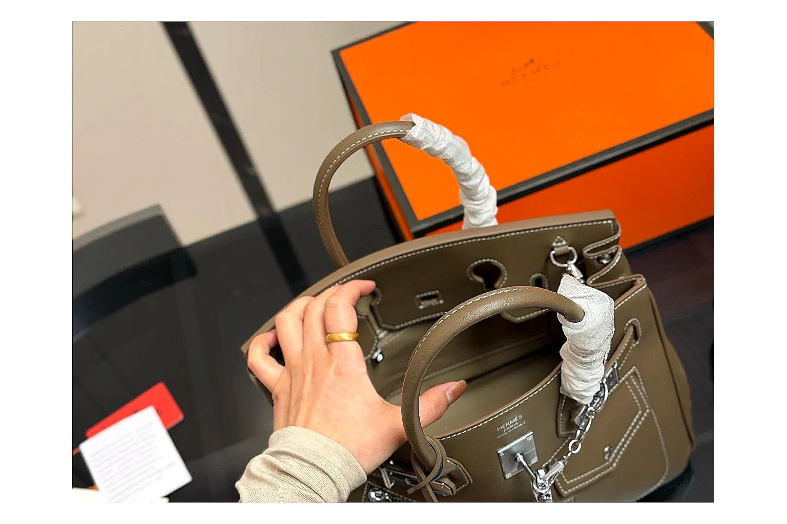 Hermes Birkin Style Olive spreadsheet record photo showing olive leather structured body, top handles, flap-and-strap shape, and polished hardware