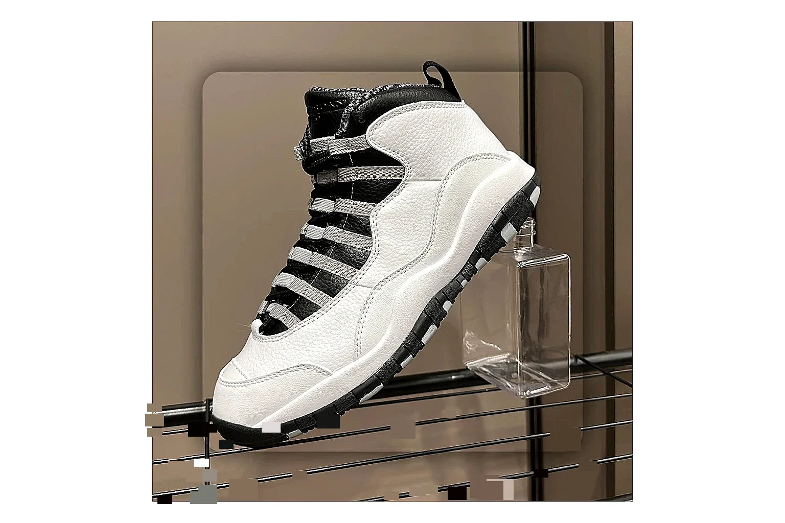Jordan Air Jordan 10 Steel White Black spreadsheet record photo showing white and black high-top court upper, striped lace panels, Jumpman heel branding, and retro sole