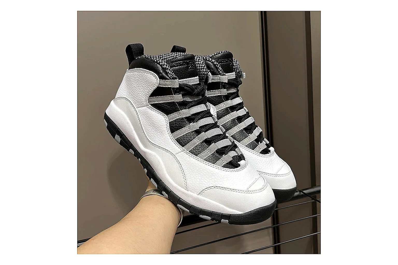 Jordan Air Jordan 10 Steel White Black spreadsheet record photo showing white and black high-top court upper, striped lace panels, Jumpman heel branding, and retro sole thumbnail 3