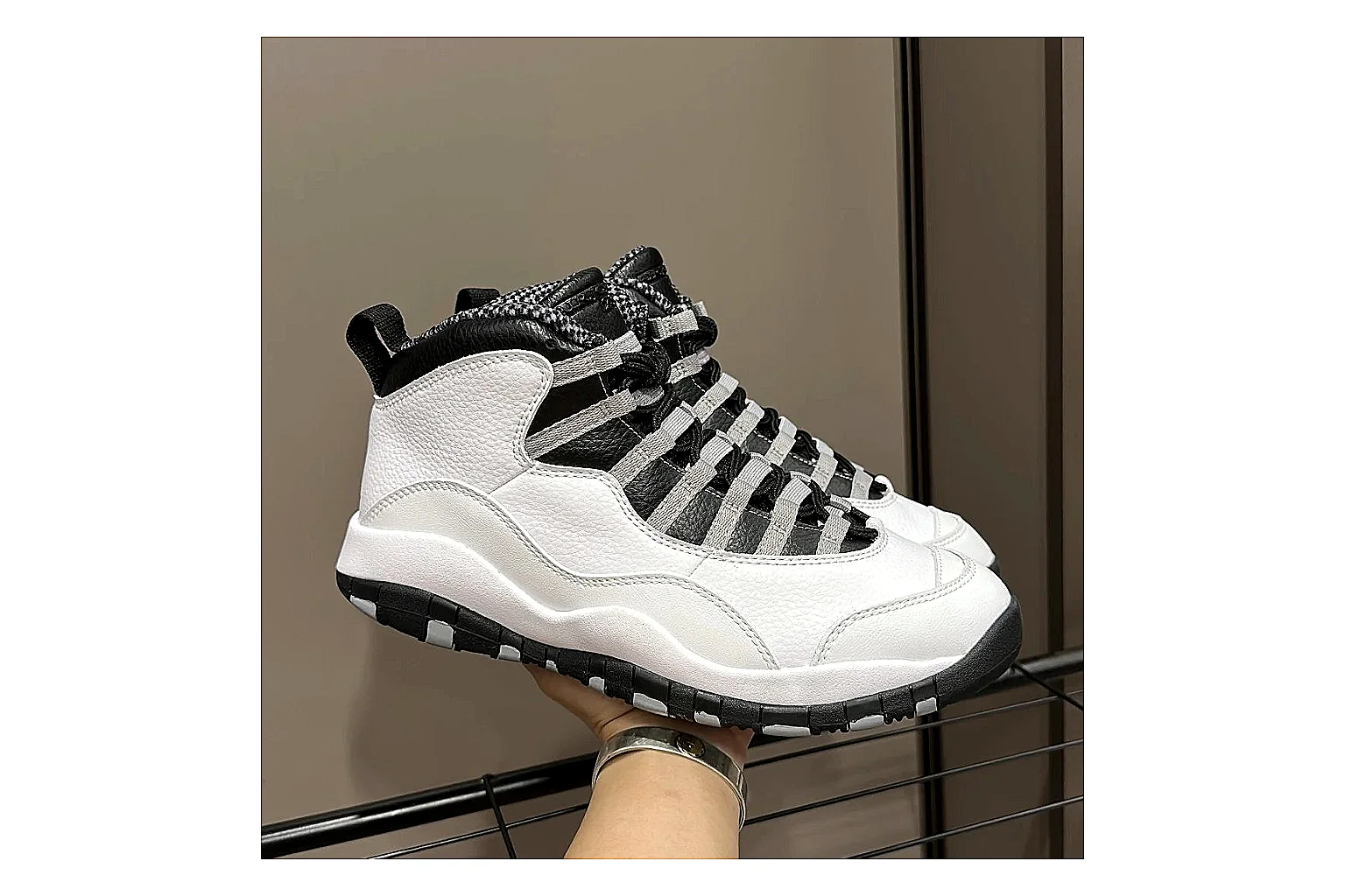 Jordan Air Jordan 10 Steel White Black spreadsheet record photo showing white and black high-top court upper, striped lace panels, Jumpman heel branding, and retro sole thumbnail 6
