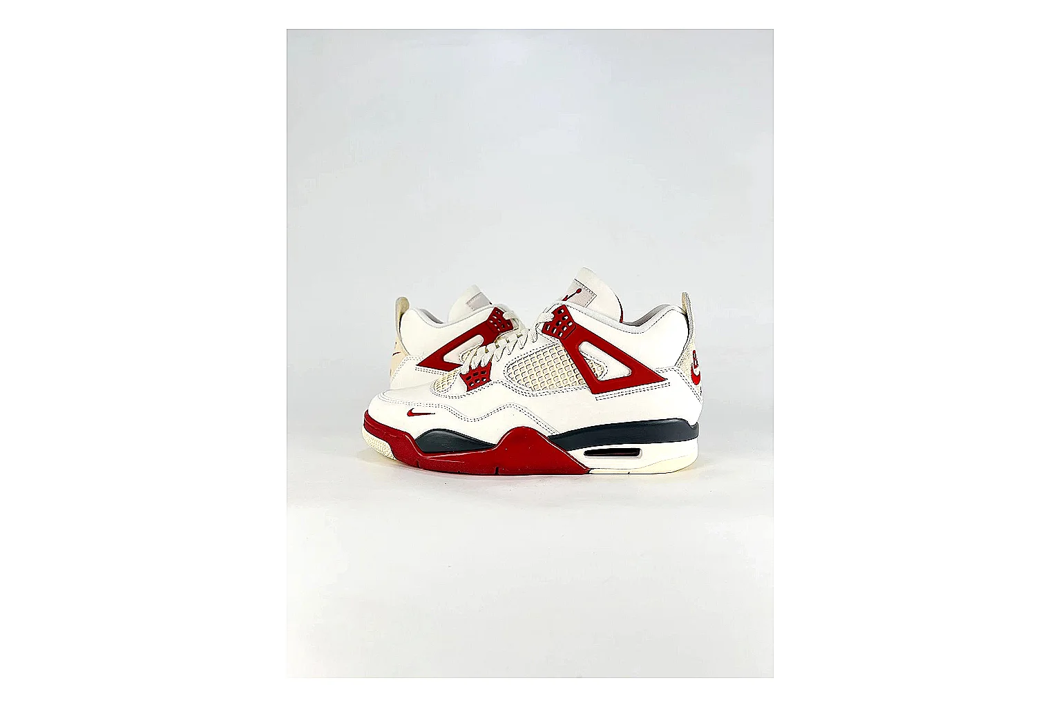 Jordan Air Jordan 4 White Red Sneakers spreadsheet record image with white red retro basketball sneakers with leather texture, side-profile shape, upper panel lines, and outsole detail