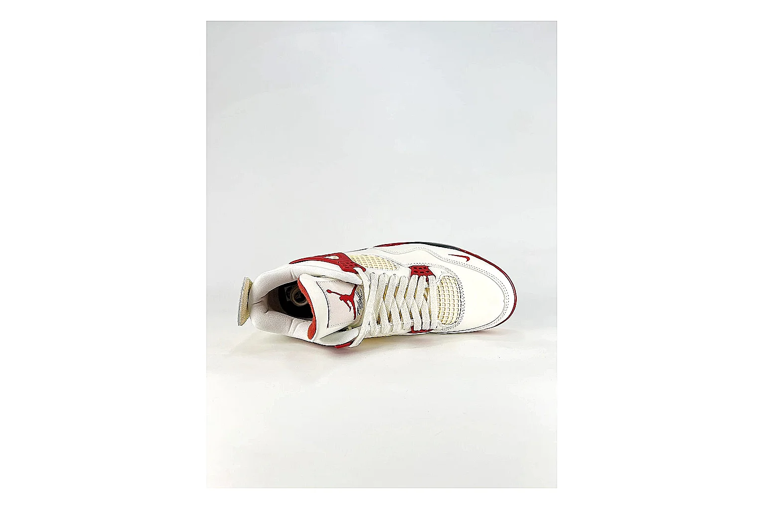 Jordan Air Jordan 4 White Red Sneakers spreadsheet record image with white red retro basketball sneakers with leather texture, side-profile shape, upper panel lines, and outsole detail thumbnail 2