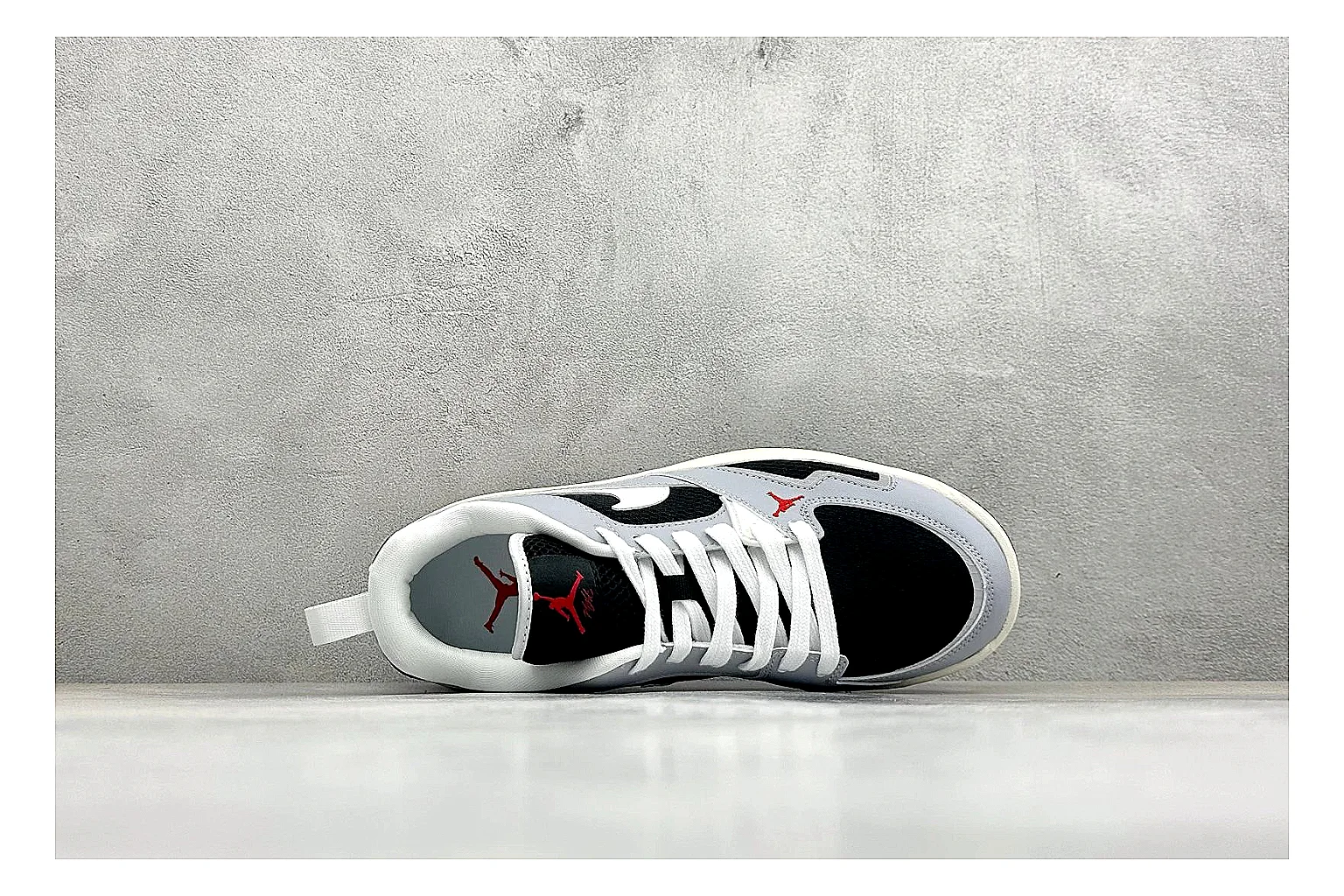 Jordan CMFT Black White spreadsheet record photo showing black and white layered panels, low padded collar, visible Jordan styling cues, and a compact court sole thumbnail 2