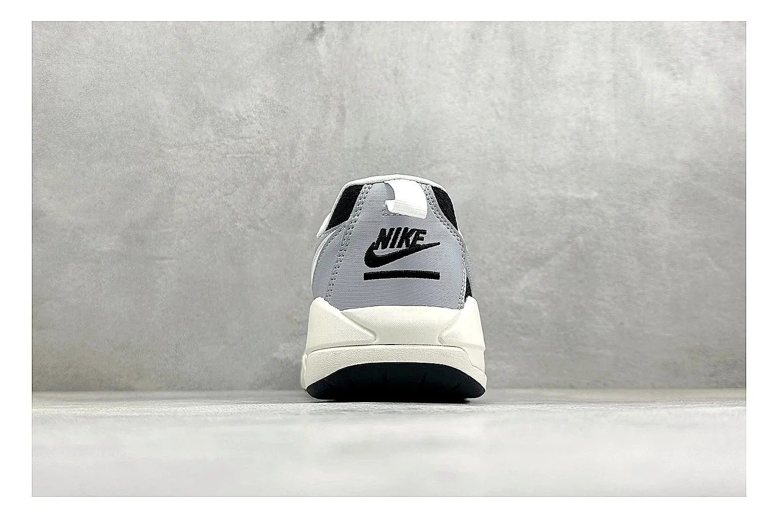 Jordan CMFT Black White spreadsheet record photo showing black and white layered panels, low padded collar, visible Jordan styling cues, and a compact court sole thumbnail 3