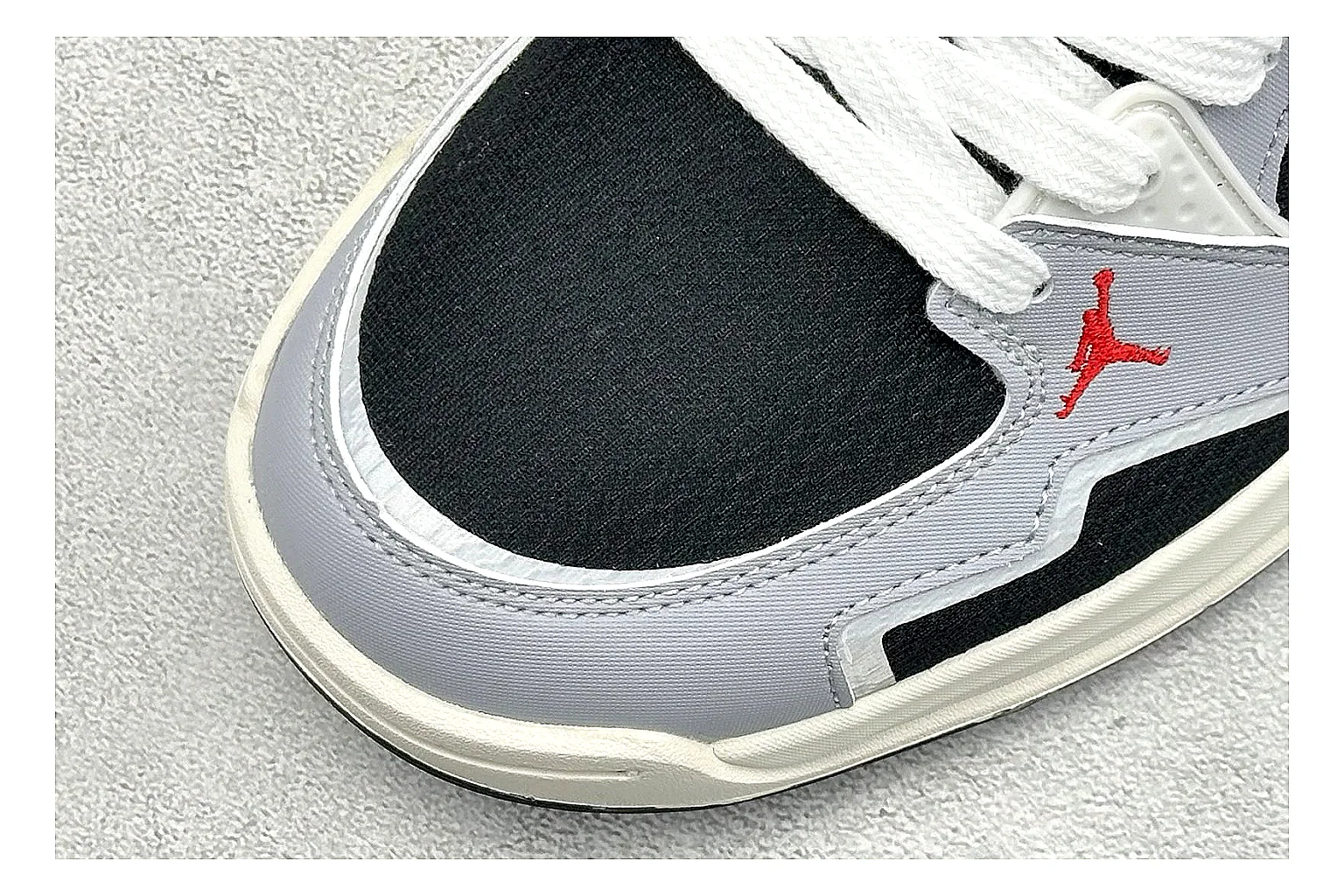 Jordan CMFT Black White spreadsheet record photo showing black and white layered panels, low padded collar, visible Jordan styling cues, and a compact court sole thumbnail 5